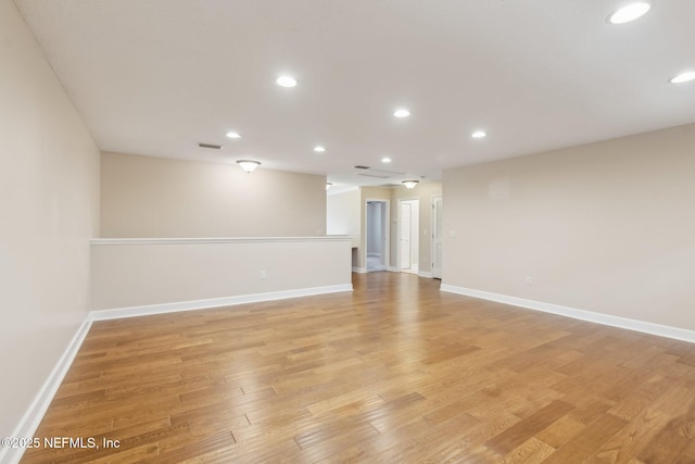 empty room with light hardwood / wood-style floors