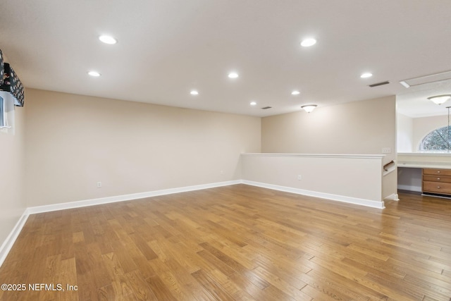 spare room featuring light hardwood / wood-style floors