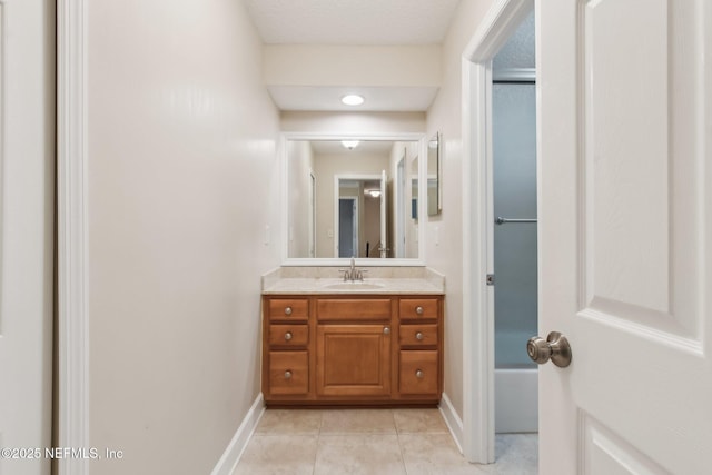 bathroom with tile patterned flooring and vanity