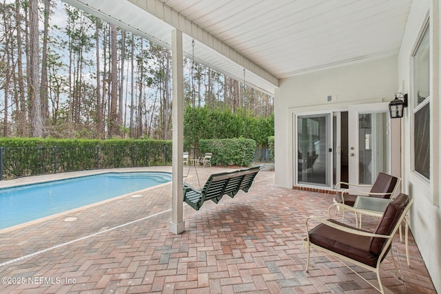 view of swimming pool featuring a patio area