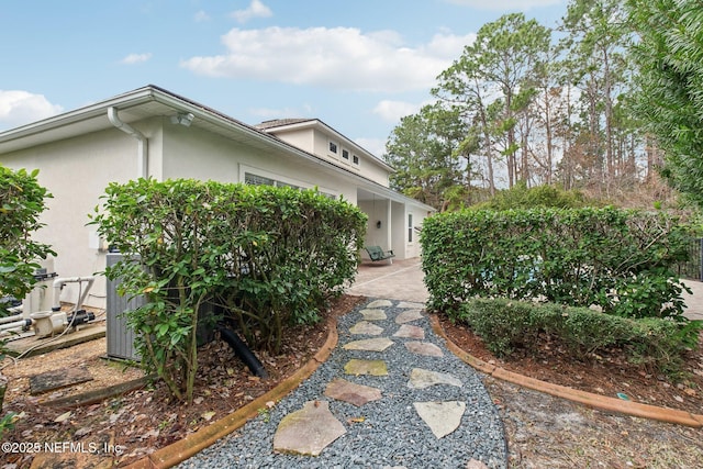 view of side of home featuring a patio area