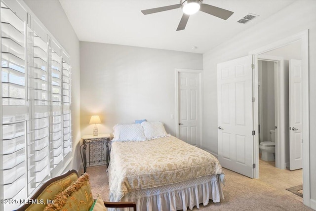 bedroom featuring light colored carpet and ceiling fan