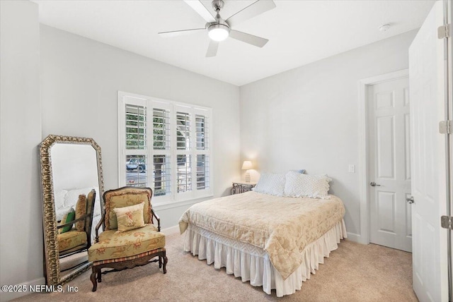 bedroom featuring light carpet and ceiling fan