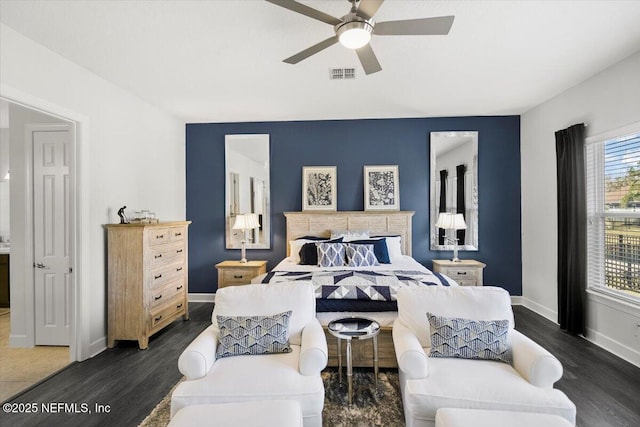 bedroom with dark hardwood / wood-style floors and ceiling fan