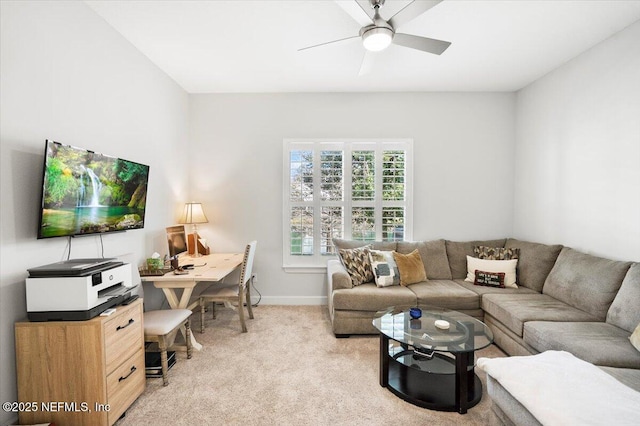 carpeted living room with ceiling fan