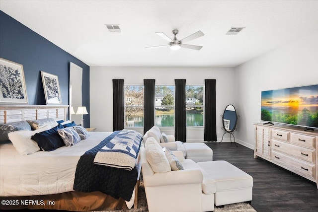 bedroom with ceiling fan and dark hardwood / wood-style floors