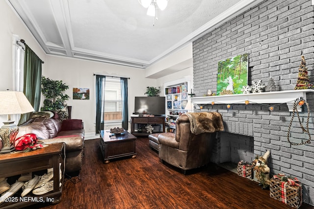 living room featuring a fireplace, beamed ceiling, coffered ceiling, dark wood-type flooring, and a textured ceiling