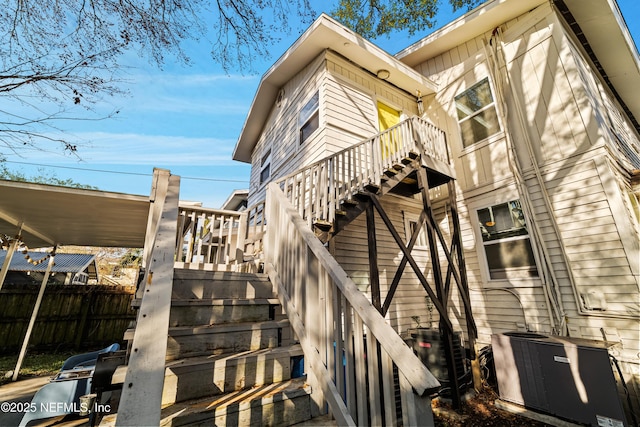 back of property featuring central air condition unit