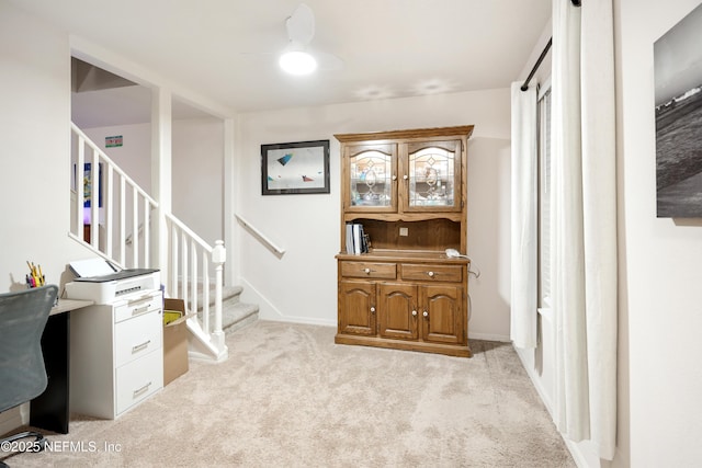 home office with light colored carpet and ceiling fan