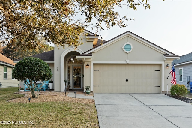 ranch-style home featuring a garage and a front lawn