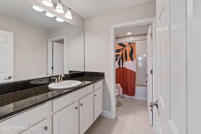 full bathroom featuring tile patterned floors, toilet, a textured ceiling, vanity, and shower / bathtub combination with curtain