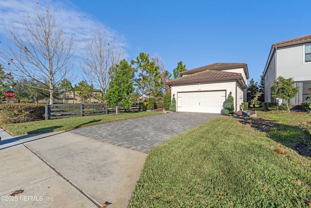 view of front facade with a garage and a front yard