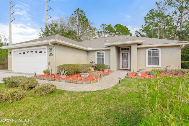 ranch-style house featuring a front yard, driveway, an attached garage, and stucco siding