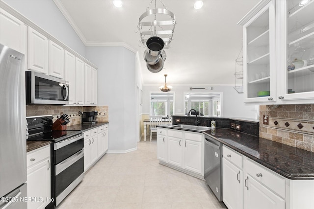 kitchen with stainless steel appliances, a sink, white cabinets, and crown molding