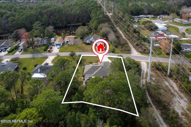 aerial view with a residential view and a view of trees