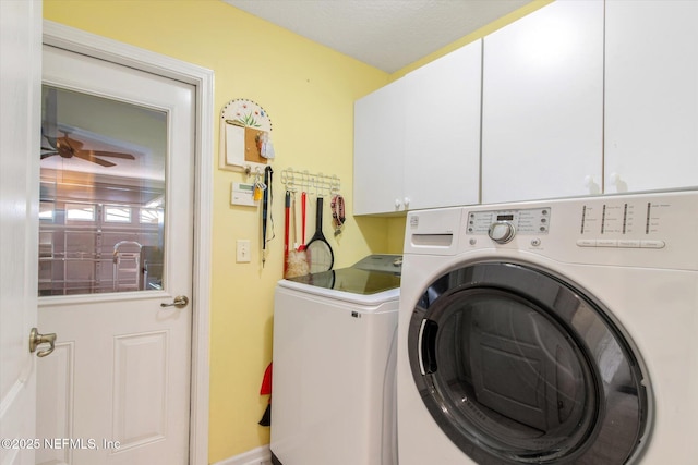 clothes washing area with cabinet space and washing machine and clothes dryer