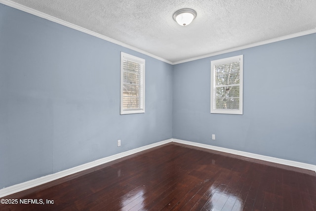 spare room featuring hardwood / wood-style flooring and a textured ceiling