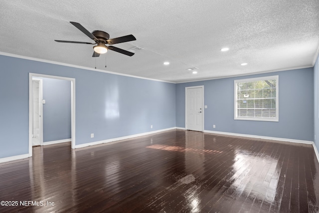 spare room with dark wood-type flooring, ceiling fan, ornamental molding, and a textured ceiling