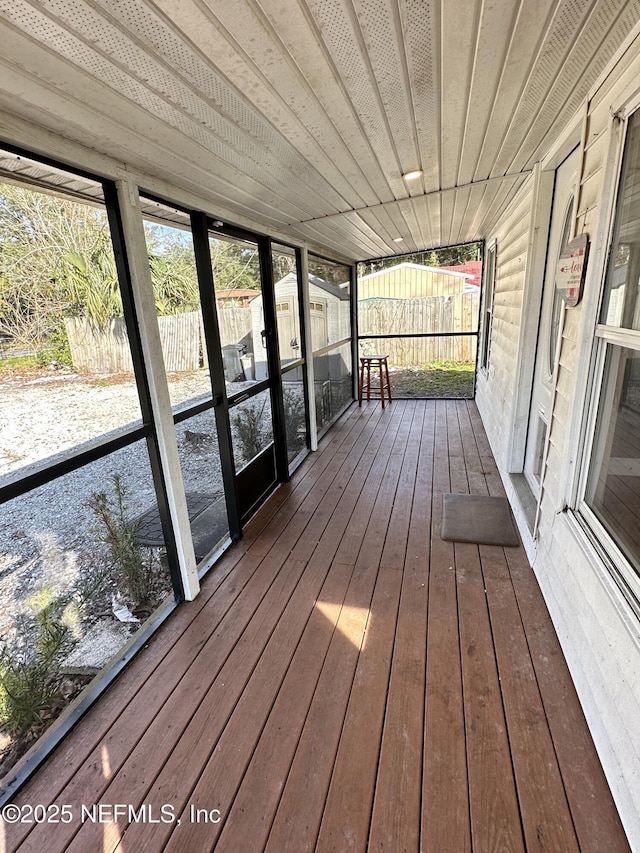 unfurnished sunroom featuring wood ceiling