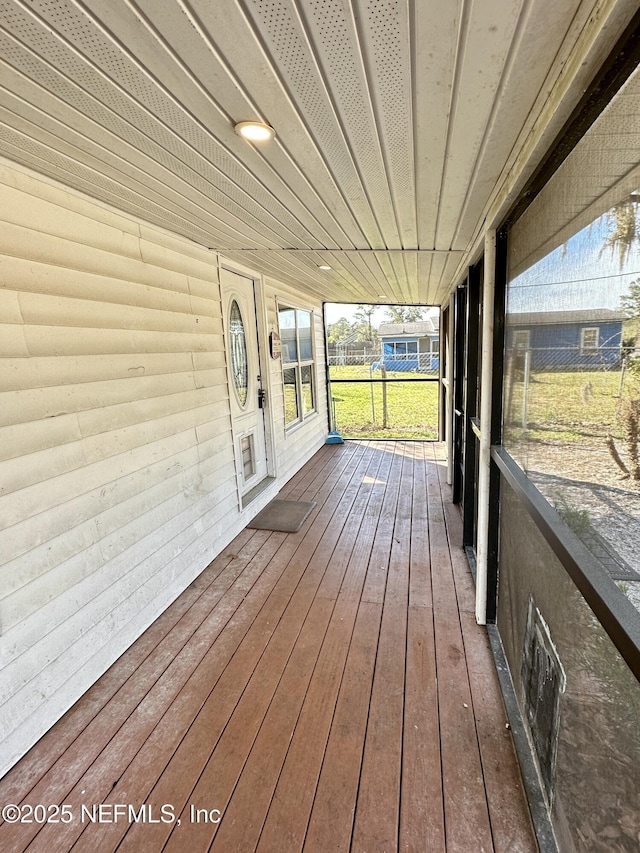 unfurnished sunroom with wooden ceiling