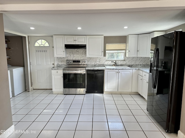 kitchen with white cabinets, washer / clothes dryer, sink, and black appliances