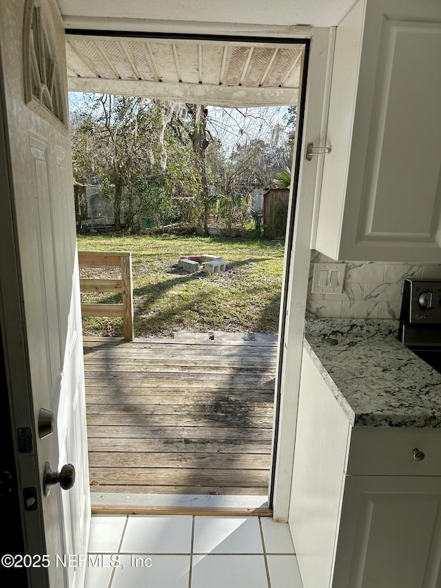 doorway to outside featuring light tile patterned floors