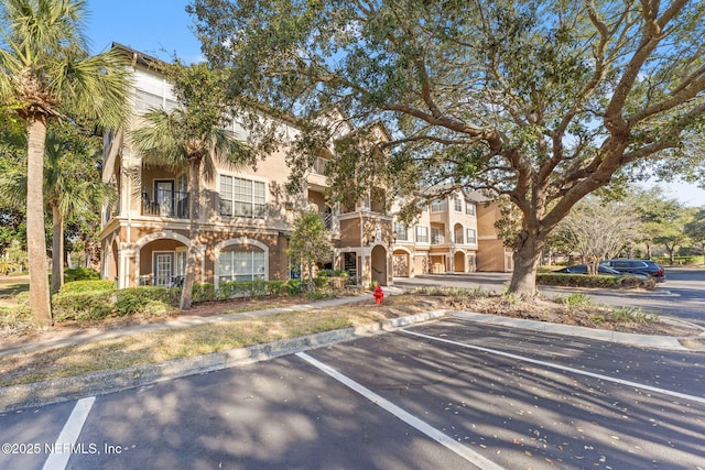 mediterranean / spanish-style home with a balcony