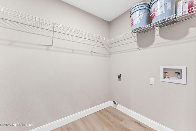 laundry room with hookup for a washing machine, wood-type flooring, and hookup for an electric dryer