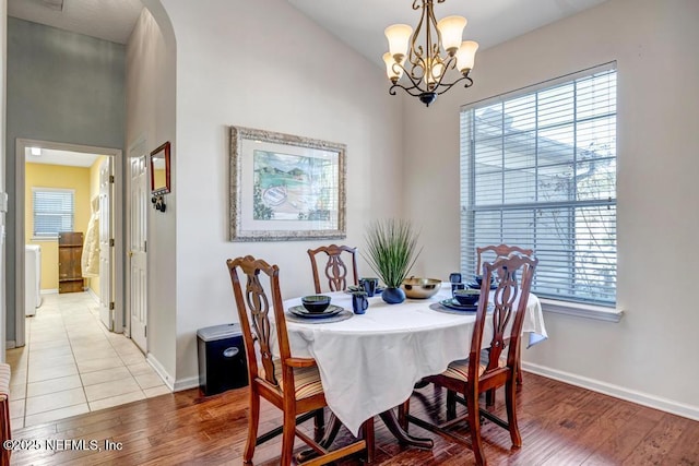 dining area with a chandelier and hardwood / wood-style floors