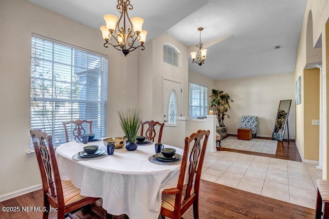 dining room with an inviting chandelier and light tile patterned floors