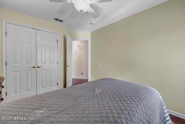 bedroom featuring ceiling fan and a closet