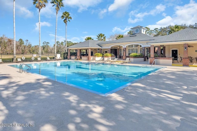 view of swimming pool with a patio