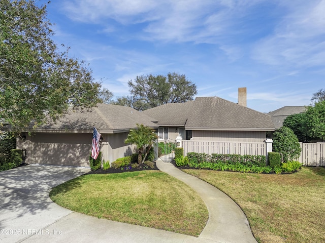 ranch-style house featuring a garage and a front yard