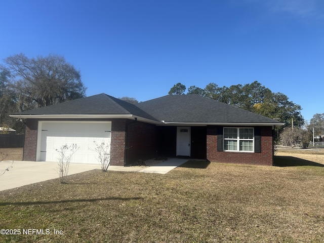 ranch-style home with a garage and a front yard