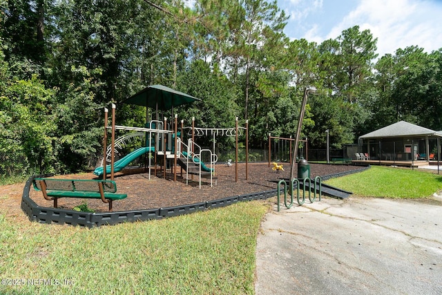 view of playground featuring a lawn