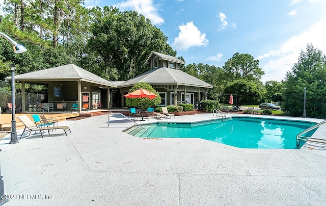 view of swimming pool featuring a patio