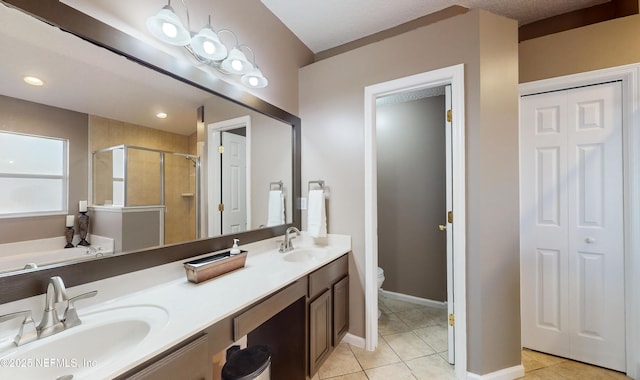 full bathroom with vanity, toilet, separate shower and tub, and tile patterned flooring