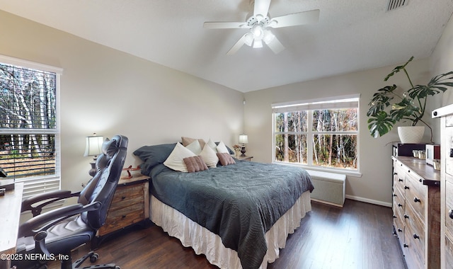 bedroom featuring ceiling fan and dark hardwood / wood-style flooring