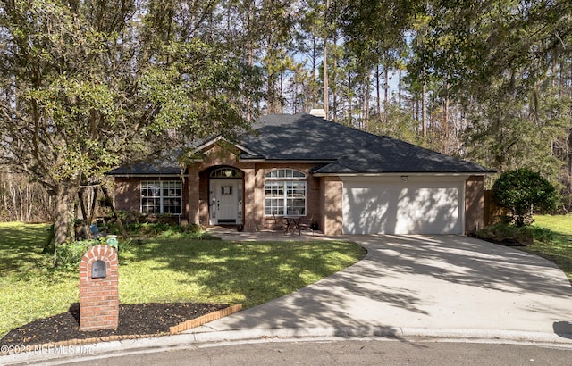 view of front of home with a garage and a front yard