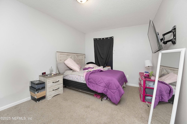 carpeted bedroom featuring a textured ceiling