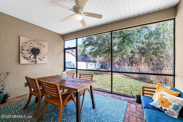 sunroom / solarium with ceiling fan