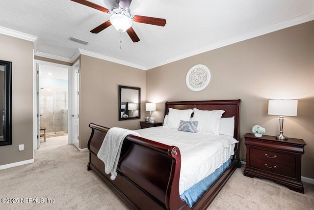 carpeted bedroom with crown molding, a textured ceiling, ceiling fan, and ensuite bathroom