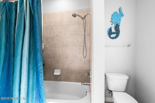 bathroom featuring toilet and shower / tub combo