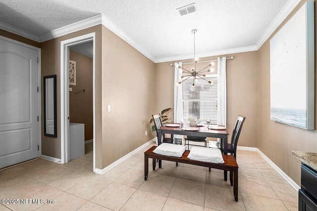 dining room with light tile patterned floors, crown molding, a textured ceiling, and a chandelier