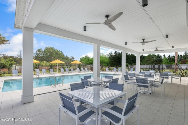 view of patio / terrace featuring a community pool and ceiling fan