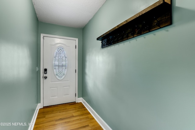 54110 Marlee Rd, Callahan, FL 32011 - doorway to outside with a textured ceiling and light hardwood / wood-style floors