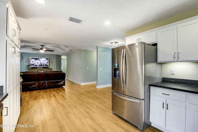 54110 Marlee Rd, Callahan, FL 32011 - kitchen featuring ceiling fan, stainless steel fridge with ice dispenser, light hardwood / wood-style flooring, and white cabinets