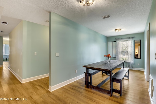 54110 Marlee Rd, Callahan, FL 32011 - dining space with light hardwood / wood-style floors and a textured ceiling
