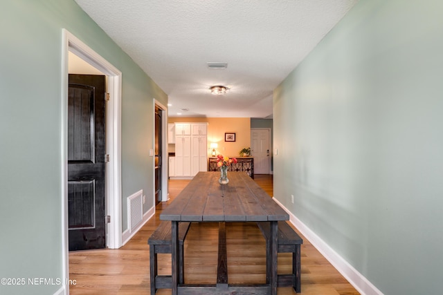54110 Marlee Rd, Callahan, FL 32011 - dining area with a textured ceiling and light wood-type flooring