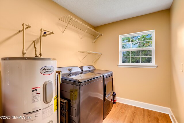 54110 Marlee Rd, Callahan, FL 32011 - laundry room with separate washer and dryer, water heater, and light wood-type flooring